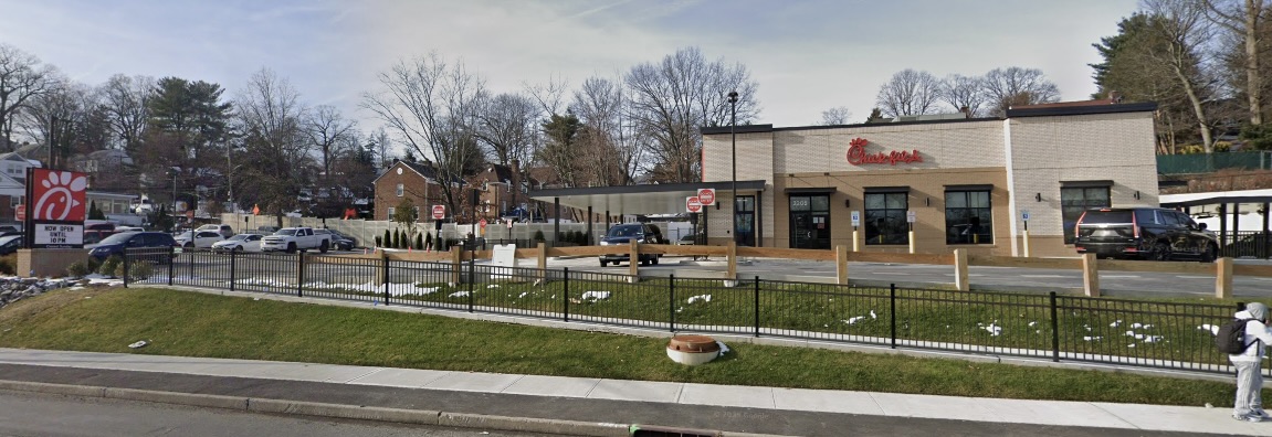 Wide view of Chick-fil-A site with noise barrier wall